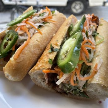Pho Mi Rittenhouse - two sub sandwiches on a plate - Vietnamese Near Me - Philadelphia, Pennsylvania Pho Mi Rittenhouse - two sub sandwiches on a plate - Vietnamese Near Me - Philadelphia, Pennsylvania