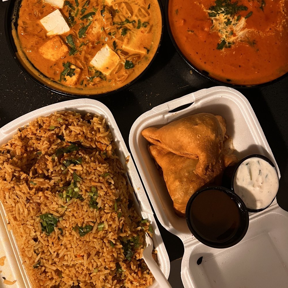 Tikka Masala - Paneer lababdar top left, butter chicken top right. Lamb biryani and veg samosas. - Indian Near Me - Nobleton, Ontario Tikka Masala - Paneer lababdar top left, butter chicken top right. Lamb biryani and veg samosas. - Indian Near Me - Nobleton, Ontario