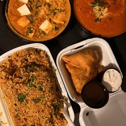 Tikka Masala - Paneer lababdar top left, butter chicken top right. Lamb biryani and veg samosas.