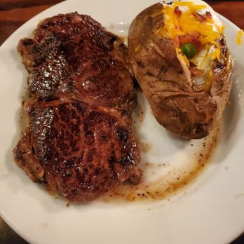 LongHorn Steakhouse - 12oz Ribeye with loaded potato - Steakhouses Near Me - Waterford, Connecticut LongHorn Steakhouse - 12oz Ribeye with loaded potato - Steakhouses Near Me - Waterford, Connecticut
