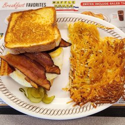 Texas bacon egg and cheese melt plate with double egg, over medium, no knife and crispy hash browns.