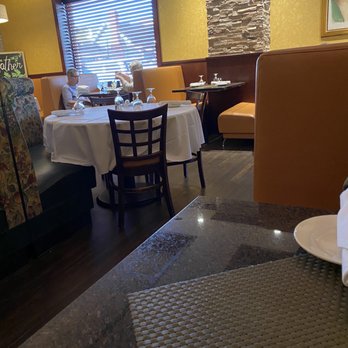 Michaelangelo's Southold - a dining area with tables and chairs - Italian Near Me - Southold, New York Michaelangelo's Southold - a dining area with tables and chairs - Italian Near Me - Southold, New York