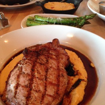 Seed Kitchen & Bar - HICKORY SMOKED PORK CHOP pimento cheese polenta, braised local greens, red wine jus (grilled asparagus and iron skillet cornbread) - American Near Me - Marietta, Georgia Seed Kitchen & Bar - HICKORY SMOKED PORK CHOP pimento cheese polenta, braised local greens, red wine jus (grilled asparagus and iron skillet cornbread) - American Near Me - Marietta, Georgia
