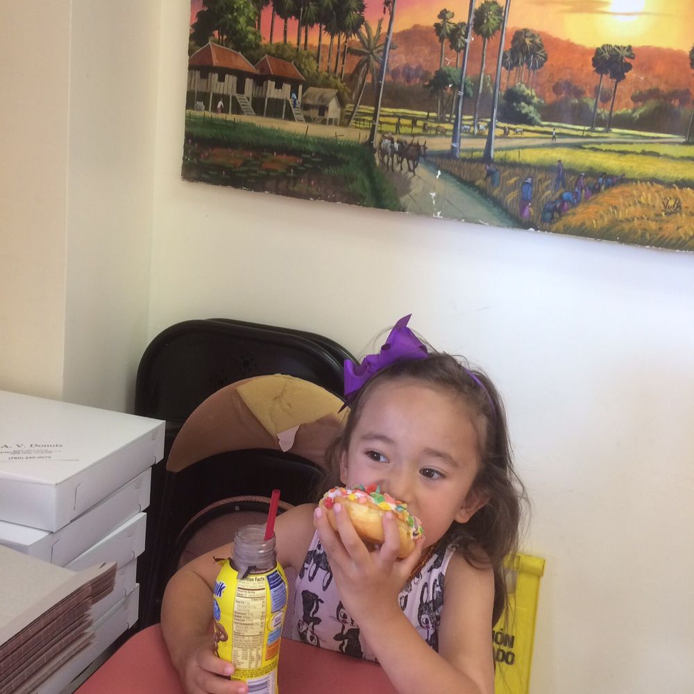 Apple Valley Donuts - My granddaughter enjoying her donut! - Coffee & Tea Near Me - Apple Valley, California