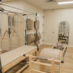 The Pilates Loft - Our studio is fully equipped with Gratz apparatus and includes chairs and barrels.
