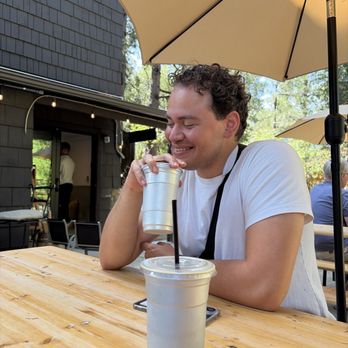 Black Mountain Coffee Roasting - Outdoor patio with two iced lattes - Coffee Roasteries Near Me - Idyllwild, California Black Mountain Coffee Roasting - Outdoor patio with two iced lattes - Coffee Roasteries Near Me - Idyllwild, California