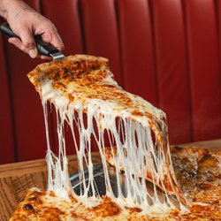 Goodfellas Pizzeria - Mass Ave - That perfect cheese pull moment.