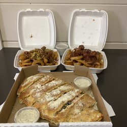 Double R Pizza - Two in the back is call Heart attack Poutine and in front is stuff dipsticks