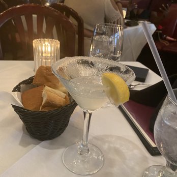 Cafe Sbisa - Basket of French bread w a lemon drop martini - Southern Near Me - New Orleans, Louisiana