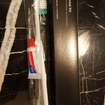 Woolley's Classic Suites - Toothbrush and smallest Colgate ever. - Hotels Near Me - Aurora, Colorado Woolley's Classic Suites - Toothbrush and smallest Colgate ever. - Hotels Near Me - Aurora, Colorado