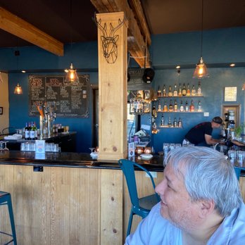 4th West Pub - a man sitting at a bar - Pubs Near Me - Escalante, Utah