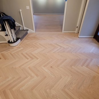 Better Flooring - an empty hallway with a staircase - Flooring Near Me - Elk Grove Village, Illinois Better Flooring - an empty hallway with a staircase - Flooring Near Me - Elk Grove Village, Illinois
