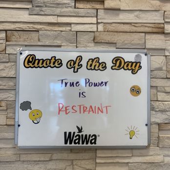 Wawa - a sign on a brick wall that says out of the day time power is restraint wawa - Gas Stations Near Me - Suffolk, Virginia