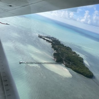 Key West Seaplane Adventures - Ariel view of the keys from the sea plane and inside shot of the sea plane with one of our guests as co-pilot. - Tours Near Me - Key West, Florida Key West Seaplane Adventures - Ariel view of the keys from the sea plane and inside shot of the sea plane with one of our guests as co-pilot. - Tours Near Me - Key West, Florida