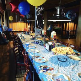 Private room set up for birthday and pizzas. Private room set up for birthday and pizzas.