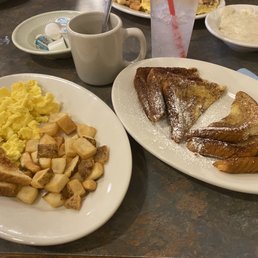 French toast with powered sugar, 2 eggs scrambled with hash and toast. French toast with powered sugar, 2 eggs scrambled with hash and toast.