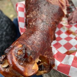 a large piece of meat on a picnic table a large piece of meat on a picnic table