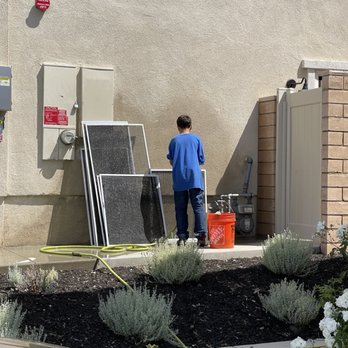 California Window Pros - Son doing the pressure washing chores on the screens - Window Washing Near Me California Window Pros - Son doing the pressure washing chores on the screens - Window Washing Near Me