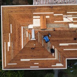 Drone photo of roof after tear-off, showing repair work underway (photo provided by Top Roofing) Drone photo of roof after tear-off, showing repair work underway (photo provided by Top Roofing)