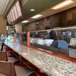 Life Time - Countertop area with a small kitchen.