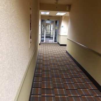 Quality Inn - Brightly lit hallway to the room. - Hotels Near Me - Fresno, California Quality Inn - Brightly lit hallway to the room. - Hotels Near Me - Fresno, California