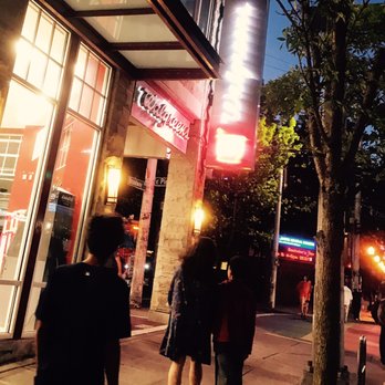 Walgreens - people walking down a sidewalk at night - Drugstores Near Me - Seattle, Washington Walgreens - people walking down a sidewalk at night - Drugstores Near Me - Seattle, Washington