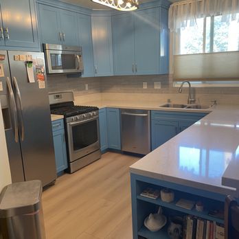 Colt Restoration - Countertops, backsplash, new light fixture, with a bookcase. - Damage Restoration Near Me Colt Restoration - Countertops, backsplash, new light fixture, with a bookcase. - Damage Restoration Near Me