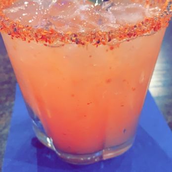 Social House Kitchen and Bar - Strawberry margarita on the rocks with Tajin on the rim - Burgers Near Me - Bakersfield, California Social House Kitchen and Bar - Strawberry margarita on the rocks with Tajin on the rim - Burgers Near Me - Bakersfield, California