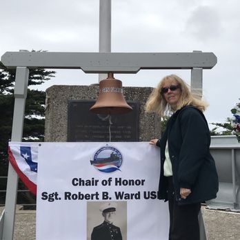 USS San Francisco Memorial - Standing next to a picture of her father - Landmarks & Historical Buildings Near Me - San Francisco, California USS San Francisco Memorial - Standing next to a picture of her father - Landmarks & Historical Buildings Near Me - San Francisco, California