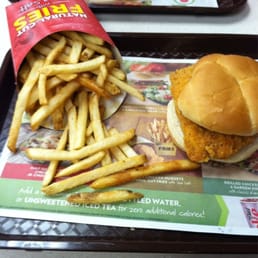 a chicken sandwich and fries on a tray