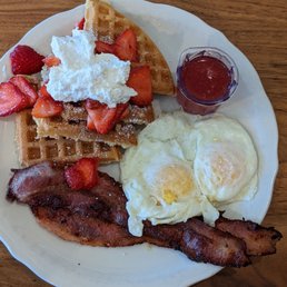 Strawberry Waffles w/ Eggs over medium and Bacon Strawberry Waffles w/ Eggs over medium and Bacon