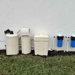Minimize visibility next to the home's roadside sidewall; whole-house water filtration system.