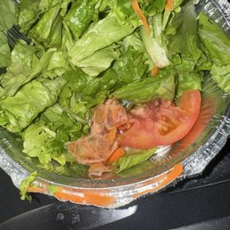 Shrimp shell. It was in the bottom of the salad. Contaminated the whole dish Shrimp shell. It was in the bottom of the salad. Contaminated the whole dish