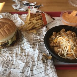 a hamburger and fries on a tray a hamburger and fries on a tray