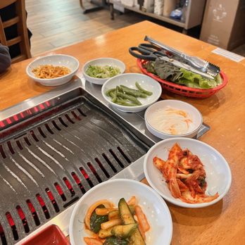 Korean Garden Restaurant - a variety of dishes on a grill - Korean Near Me - Allston, Massachusetts