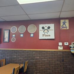 Pizza sized for convenience on wall as decorative as can be.
