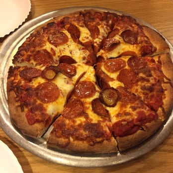 Pizzamania - This is a small! Feeds 3 adults! We got ours with wings! - Pizza Near Me - Long Beach, California
