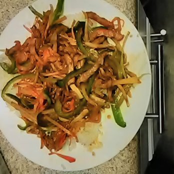Wok N Roll - Hot n spicy pork, over white rice. - Chinese Near Me - Jacksonville, Florida Wok N Roll - Hot n spicy pork, over white rice. - Chinese Near Me - Jacksonville, Florida
