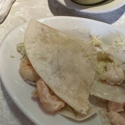 Shrimp taco in a soft shell. Luke warm served on a tiny plate. NO flavor in shrimp it was spike they were boiled in water. Shrimp taco in a soft shell. Luke warm served on a tiny plate. NO flavor in shrimp it was spike they were boiled in water.