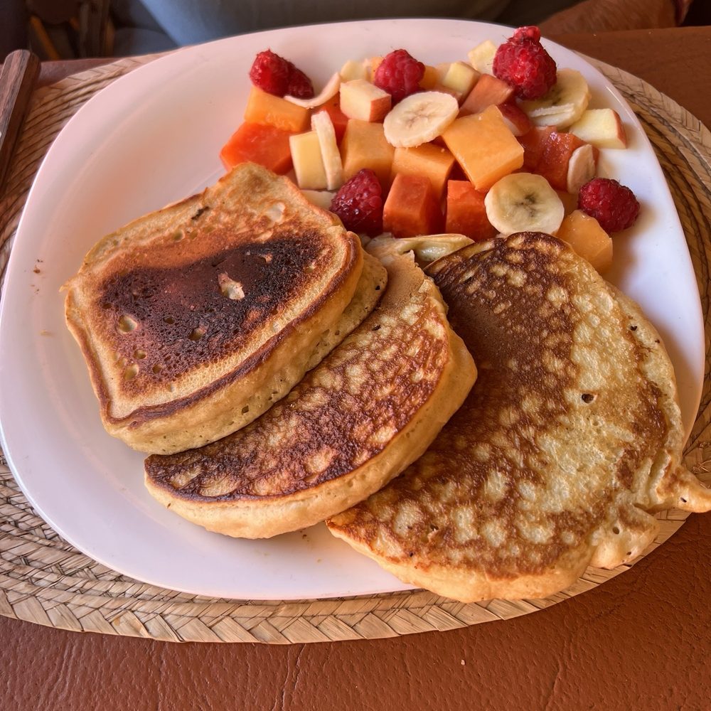 Hotcakes and fruit. Hotcakes and fruit.