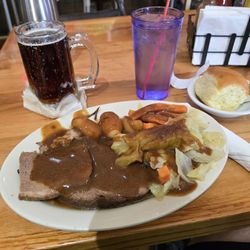 Kalmes Store & Restaurant - Pot roast, potatoes, carrots, and cabbage with a dinner roll. Amber Bock on tap served in a frosty mug!
