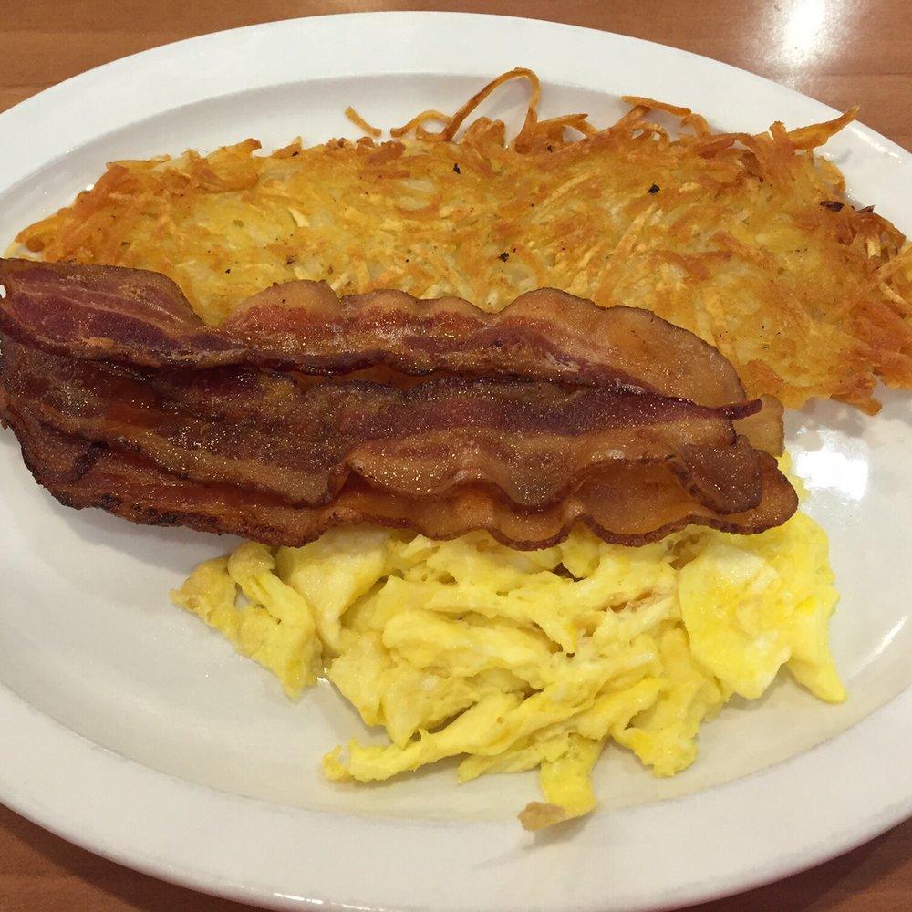 Jimmy's Egg - Traditional Breakfast - 2 eggs scrambled, 3 strips bacon, crispy hash browns, and English muffin (not shown) - Breakfast & Brunch Near Me - Omaha, Nebraska