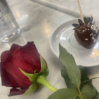 Fiore - Mothers were gifted with a long stem rose and chocolate covered strawberry..delicious - New American Near Me - Miami, Florida