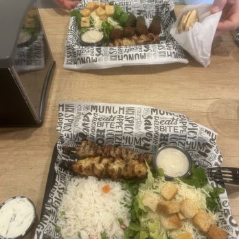 Meet the Greek - Platter with chicken and pork skewers, falafel, white rice, Cesar salads & sauces! - Greek Near Me - Wilmington, North Carolina Meet the Greek - Platter with chicken and pork skewers, falafel, white rice, Cesar salads & sauces! - Greek Near Me - Wilmington, North Carolina