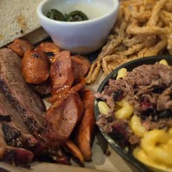 Jon’s Grille - Two meat bbq plate with mac and cheese and onion rings. Ask for the grilled peppers.