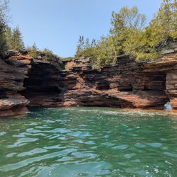 Adventures Vacations & Boat Charters - Exploring the caves at Devils Island