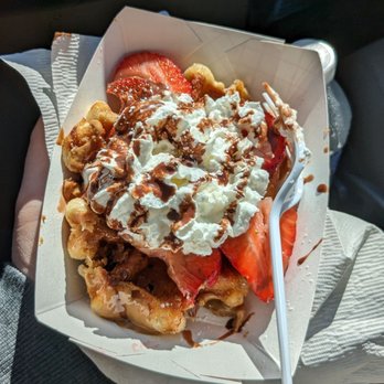 VolksWaffle - Most Wanted with strawberries, whipped cream, powdered sugar, Nutella drizzle, and Speculoos cookie butter ($6.50). - Desserts Near Me - Carmichael, California