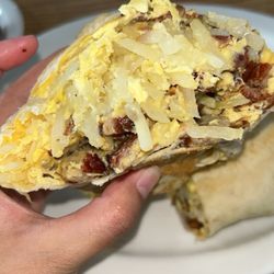 Dion’s Breakfast Cafe - Breakfast burrito with hashbrowns added inside