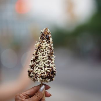 Pizza Shab - Downtown - a person holding a chocolate covered ice cream cone - Halal Near Me - Toronto, Ontario