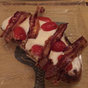 Coquinarius - Croton with cheese, bacon, and tomato. Was solid but not nearly as good as the Brie, Almond, Honey. - Wine Bars Near Me - Florence, FI Coquinarius - Croton with cheese, bacon, and tomato. Was solid but not nearly as good as the Brie, Almond, Honey. - Wine Bars Near Me - Florence, FI